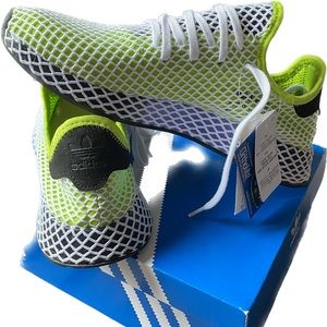 Never worn, brand new in box modern classic Adidas Deerupt.